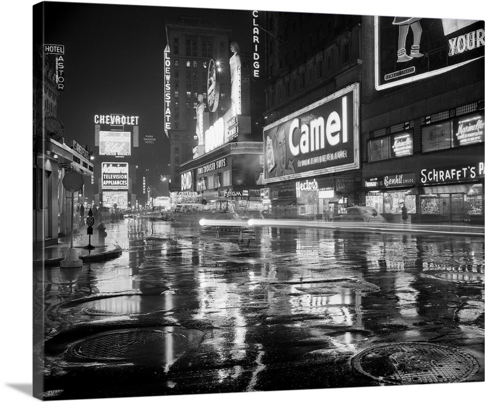 1950's Wet Rainy Streets Of Times Square At Night Neon Signs Advertising New York City NY USA.