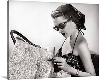 1950's Woman Wearing Bandana, Sunglasses, And Halter Top Marking Road Map