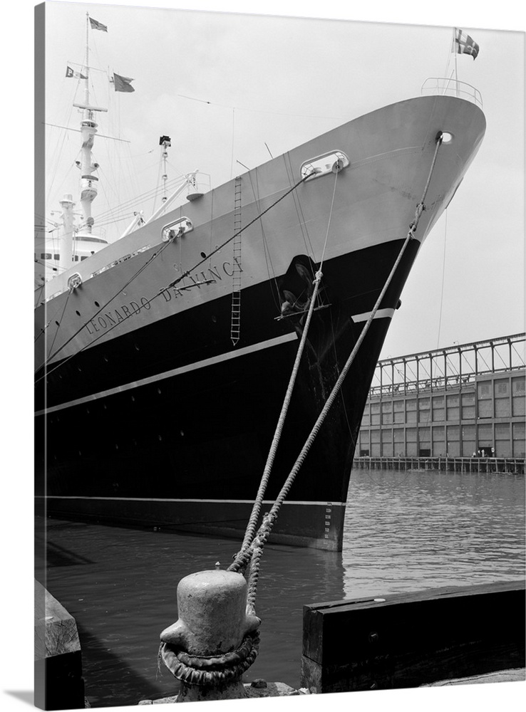 1960's Bow Of Leonardo Da Vinci Ship Tied Down To Dock With Man Scrubbing Retracted Anchor.