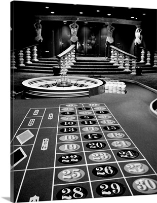 1960s Casino Viewed From End Of Roulette Table Looking Toward Statues Of Showgirls