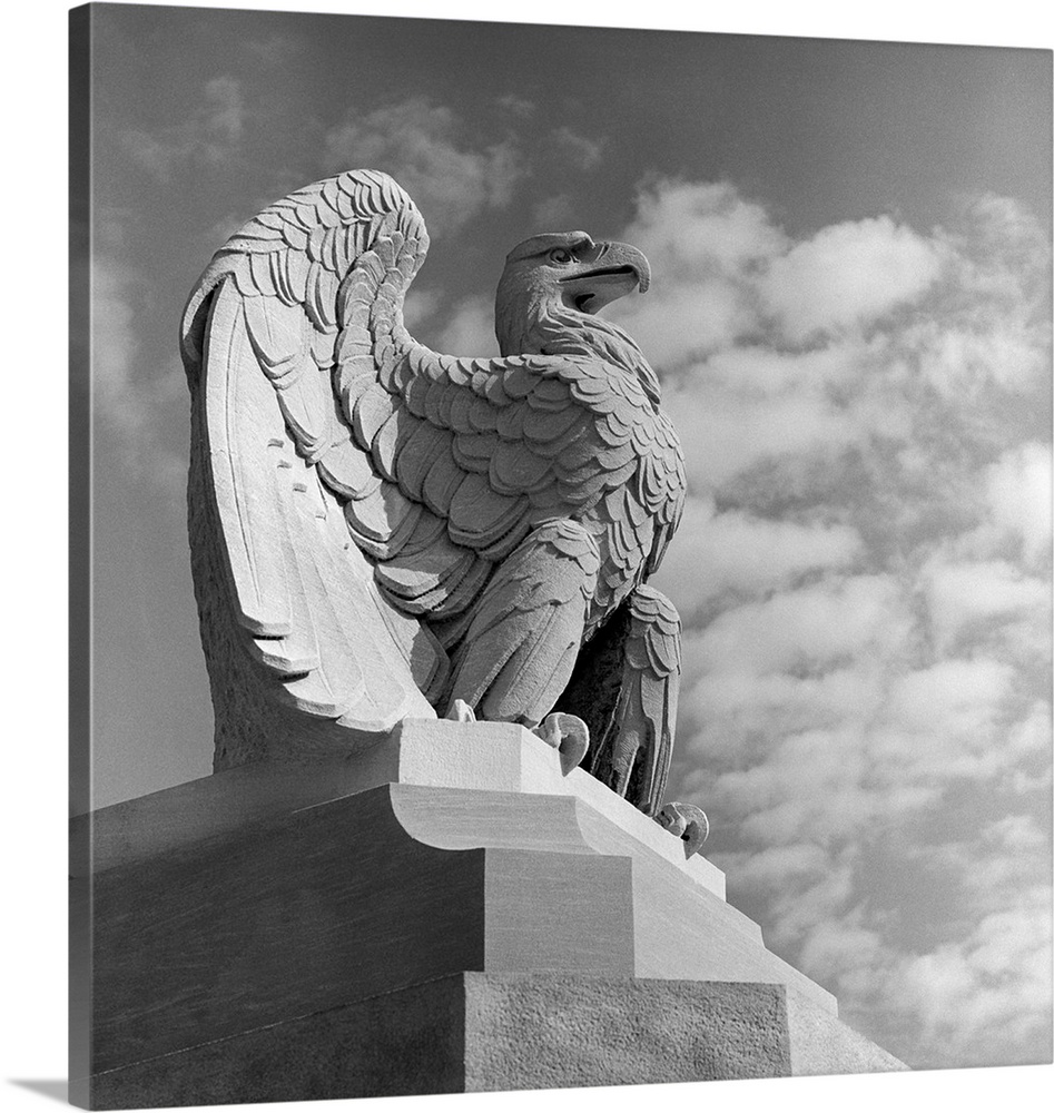 1960's Eagle Statue Against Sky Clouds Wings Spread Feathers Talons Curled Over Edge Of Base Philadelphia 30th Street.