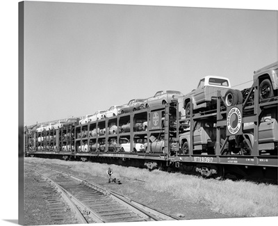 1960's Railroad Freight Train Carrying Automobiles And Pickup Trucks