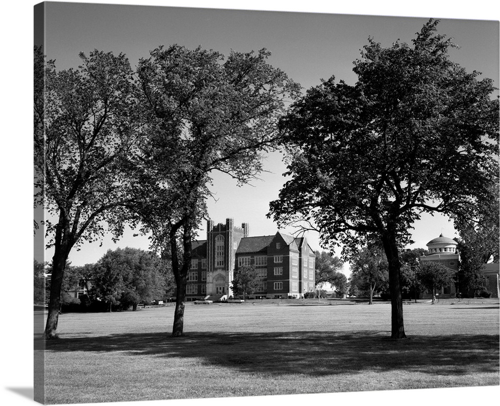 1970's Campus Of Emporia College In Kansas With Brick Buildings Nestled Among Trees.