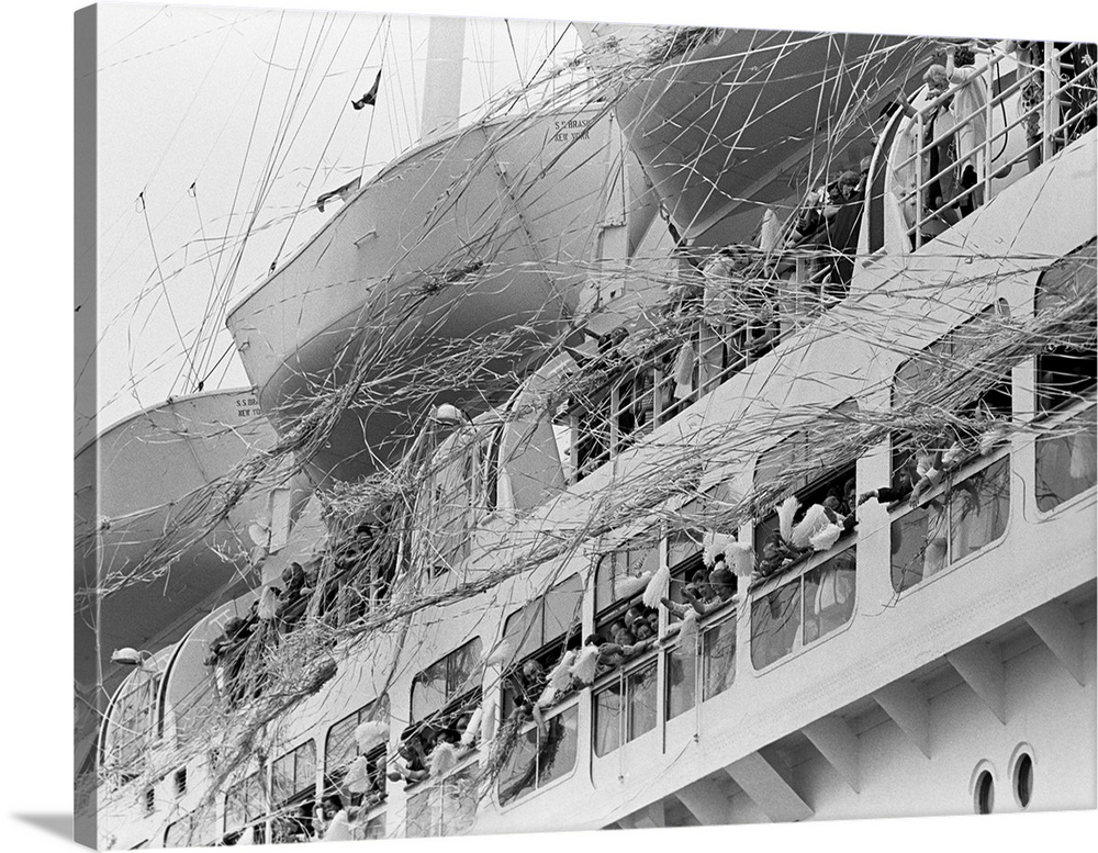 1970's Crowd Gathered On 2 Levels Of Deck Of Large Departing Cruise Ship Waving Pompoms With Paper Streamers Blowing.