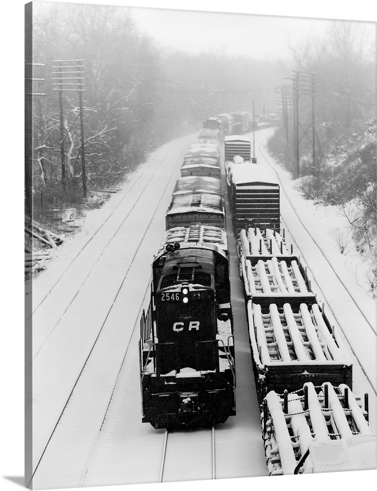 1970's Pair Of Freight Trains Traveling On Snow Covered Railroad Tracks.