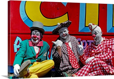 1970s Three Circus Clowns In Colorful Costumes And Hats Looking At Camera