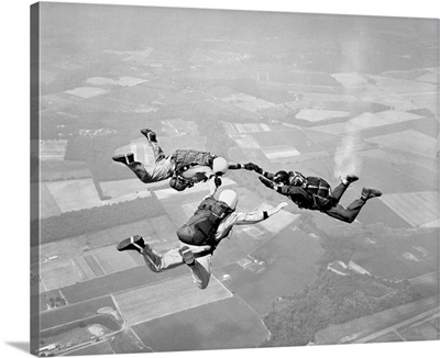 1970s Three Men Holding Hands Sky Diving