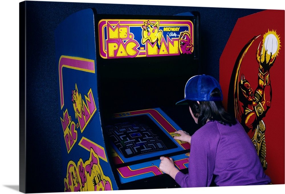 1980's  Teen Girl Playing Ms. Pac Man Video Game In Arcade