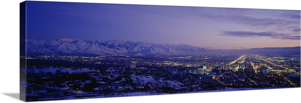 Aerial panorama of Salt Lake City lights at dusk.