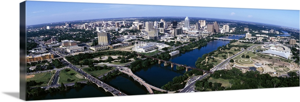 Wide photo from above of the city of Austin, Texas and the Colorado River.