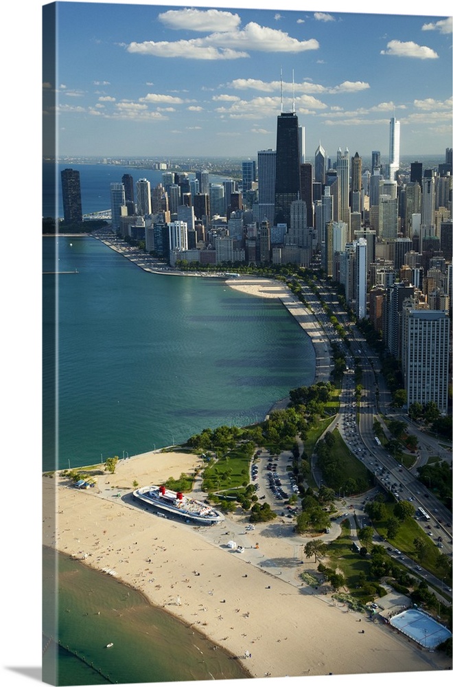 Big vertical aerial view of the city of Chicago in Cook County, Illinois (IL). People relaxing and playing in the blue-gre...