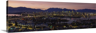 Aerial view of a city lit up at dusk, Vancouver, British Columbia, Canada