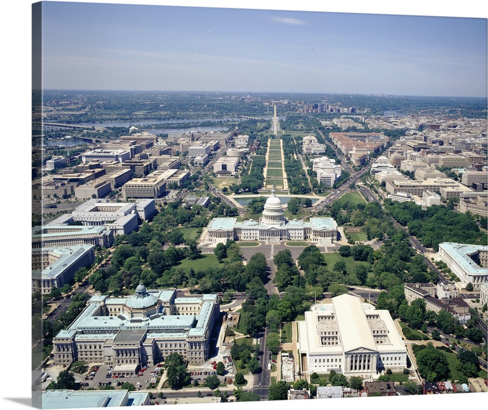 High-angle view of the Capital of the United States.  Iconic buildings, monuments, and rivers are visible.