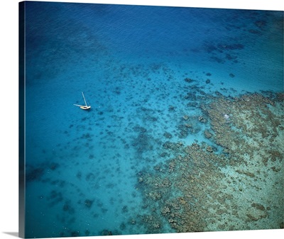 Aerial view of sailboat in the sea over coral reefs, near Isla Palominitos, Puerto Rico