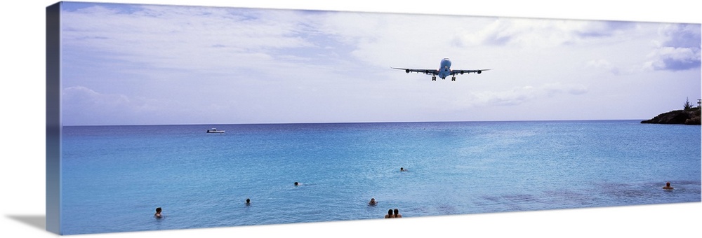 Airplane flying over the sea, Maho Beach, Sint Maarten, Netherlands Antilles