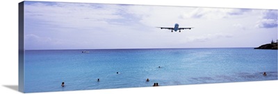 Airplane flying over the sea, Maho Beach, Sint Maarten, Netherlands Antilles