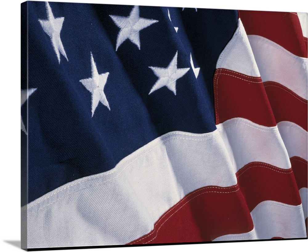 Close-up photograph of a rippling flag of the United States of America.