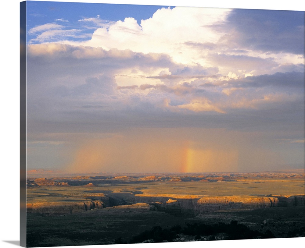 Arizona, Rainbow and thunderstorm over a landscape