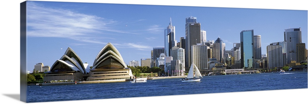 Sydney skyline panorama, including the Opera House and harbor.