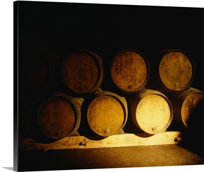 Barrels in a cellar, Chateau Pavie, St. Emilion, Bordeaux, France