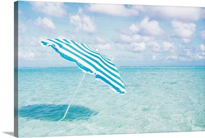 Beach umbrella in shallow water