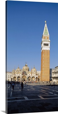 Bell tower with a cathedral in the background, St. Marks Cathedral, Venice, Italy