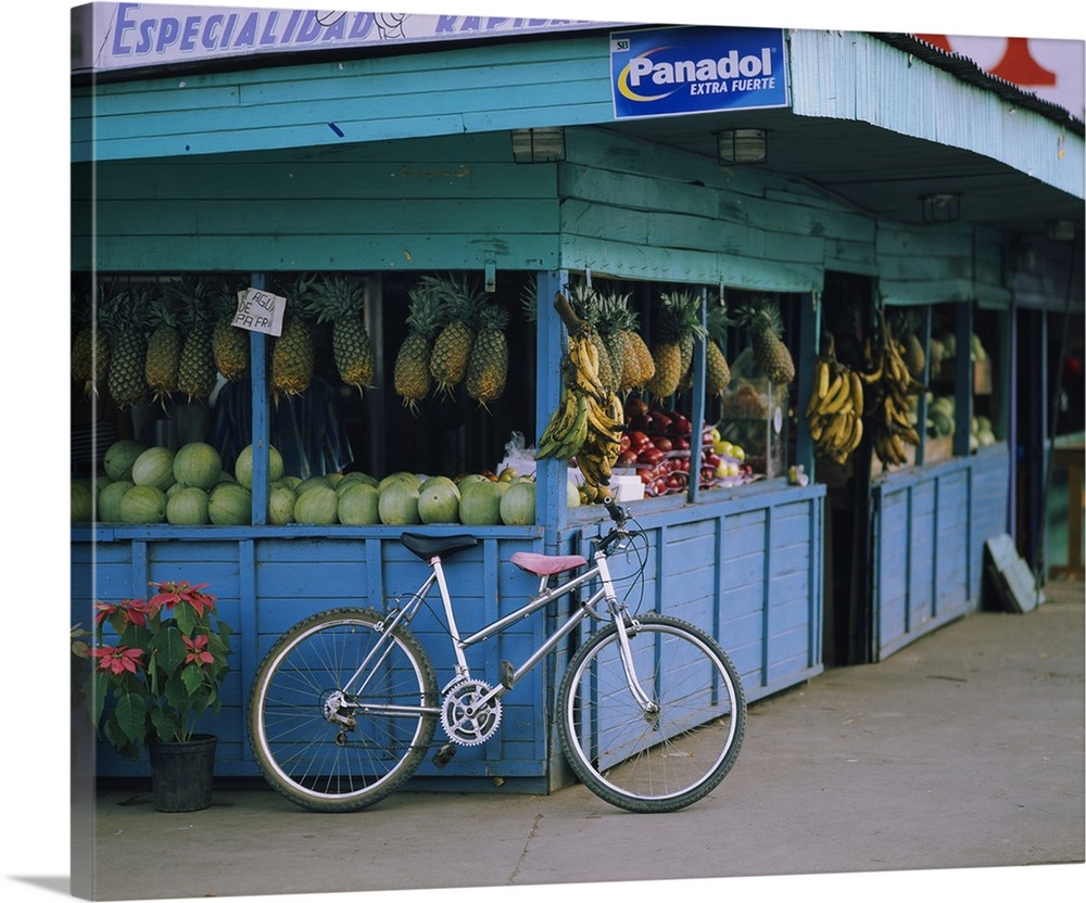 Bicycle leaning against a fruit stand, Costa Rica