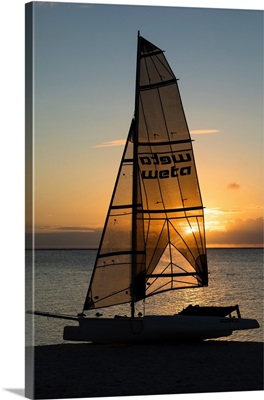 Boat on the beach at sunset, Bora Bora, Society Islands, French Polynesia