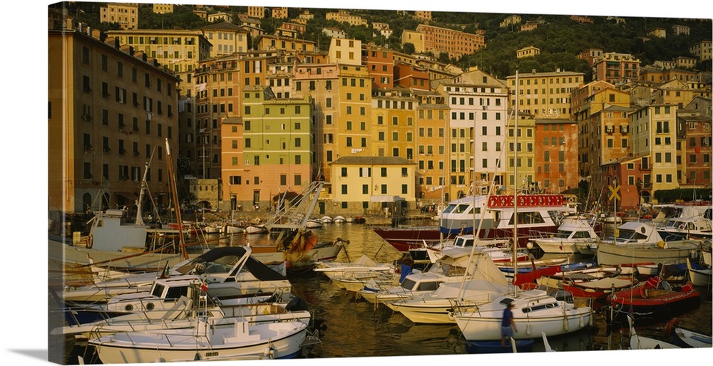 Big canvas photo art of boats in the harbor with tall buildings on a hill in the background reaching the waterfront.