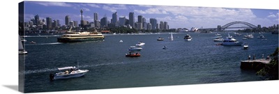 Boats in the sea with a bridge in the background, Sydney Harbor Bridge, Sydney Harbor, Sydney, New South Wales, Australia