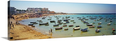Boats moored at a harbor, Playa De La Caleta, Cadiz, Andalusia, Spain