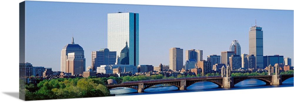 This wall art is a panoramic photograph of the city skyline over the water taken in the middle of the day.