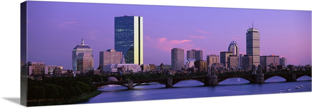 Panoramic photograph shows Longfellow Bridge spanning the Charles River in the Northeastern United States.  The background...