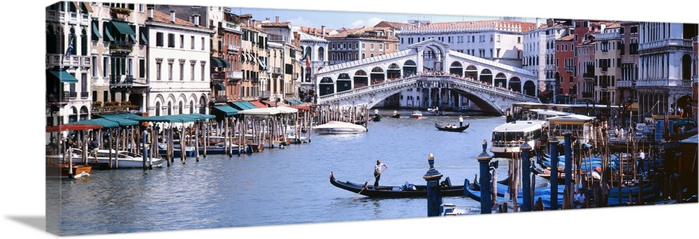 Panoramic photograph of the Grand Canal in Venice, Italy.  View of the Rialto Bridge in the background.