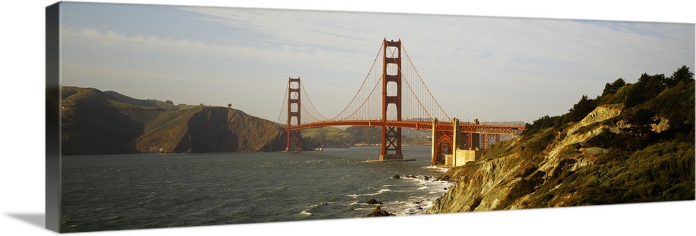 San Francisco panoramic of Golden Gate bridge with view of the bay and rocky coast.