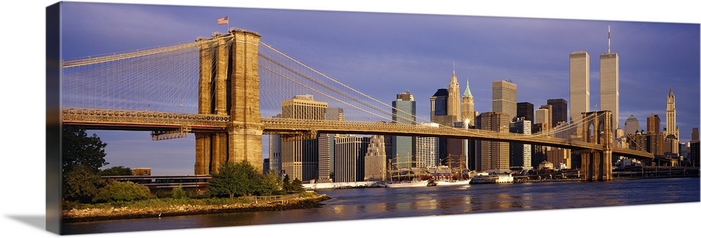 Panoramic, giant photograph of the Brooklyn Bridge in the sunlight, the New York City skyline in the background, including...