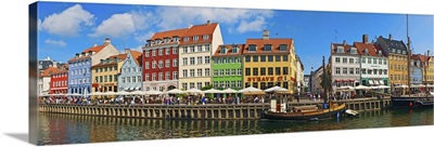 Buildings along a canal with boats, Nyhavn, Copenhagen, Denmark