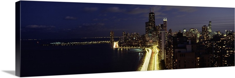 Buildings along a lake lit up at night, Lakeshore Drive, Navy Pier ...