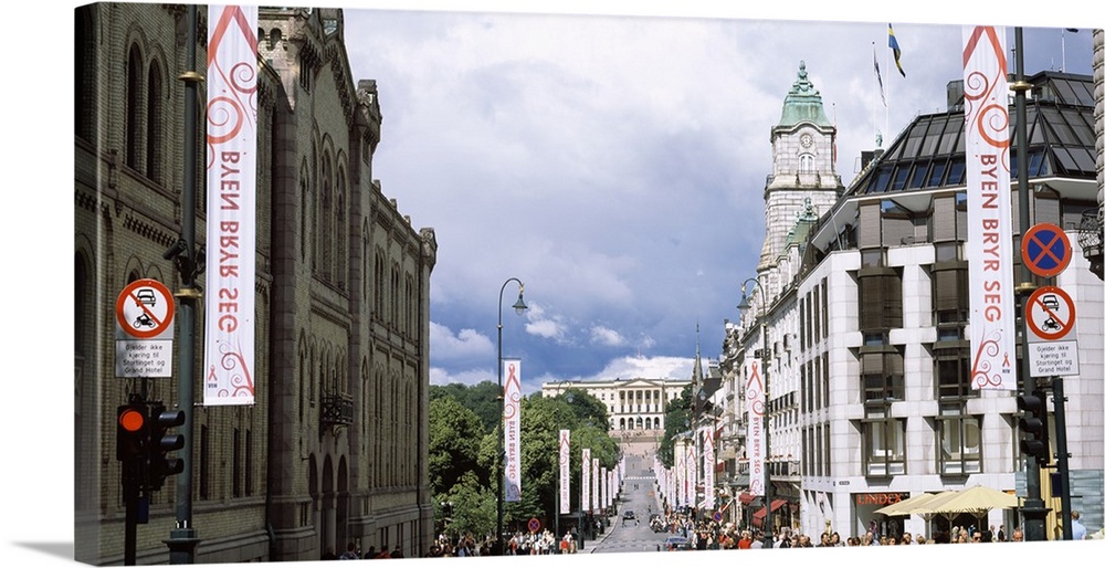 Buildings along a street with Royal Palace in the background Karl Johan Street Oslo Norway