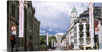 Buildings along a street with Royal Palace in the background Karl Johan Street Oslo Norway