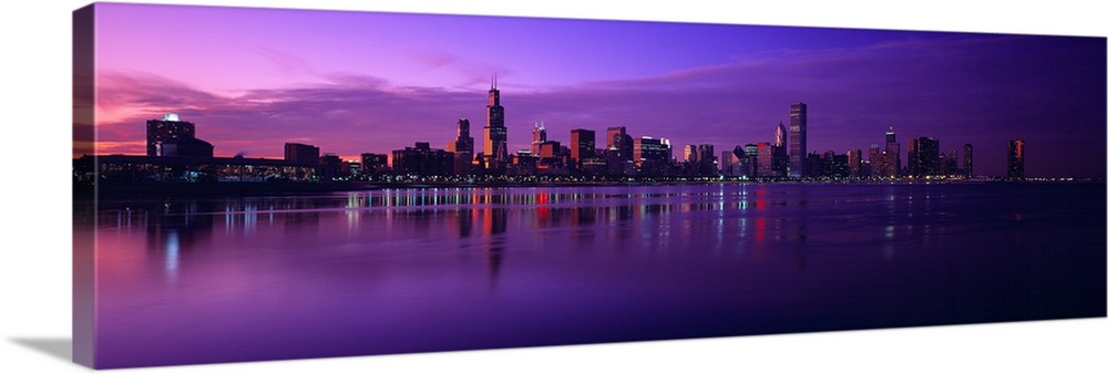Giant, landscape photograph of Lake Michigan beneath a vibrant sunset and the Chicago skyline on the horizon, including th...