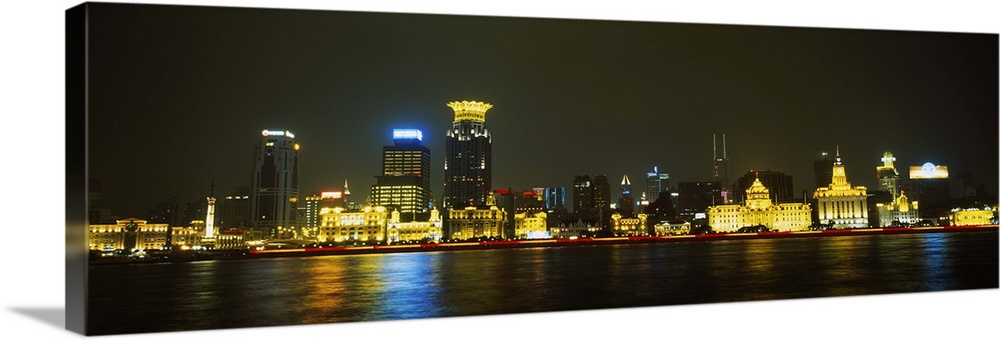 Buildings at the waterfront lit up at night, Pudong, Huangpu River, Shanghai, China