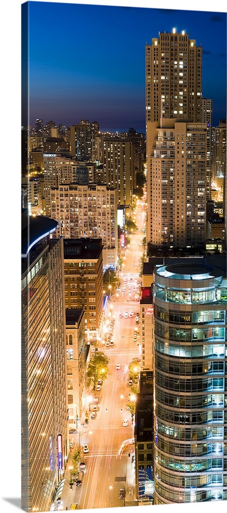 Buildings in a city lit up at dusk, Dearborn Street, North Side, Chicago, Illinois,
