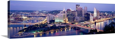 Buildings in a city lit up at dusk, Pittsburgh, Allegheny County, Pennsylvania