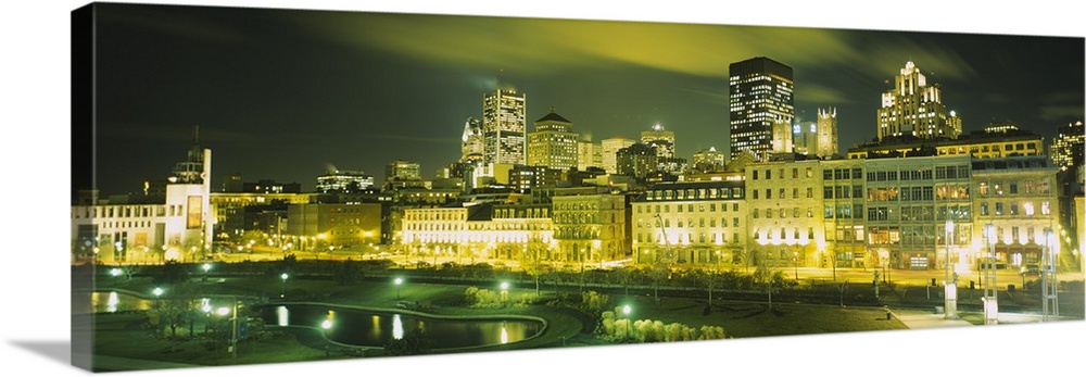 Buildings in a city lit up at night, Auberge Du Vieux Port, Montreal, Quebec, Canada