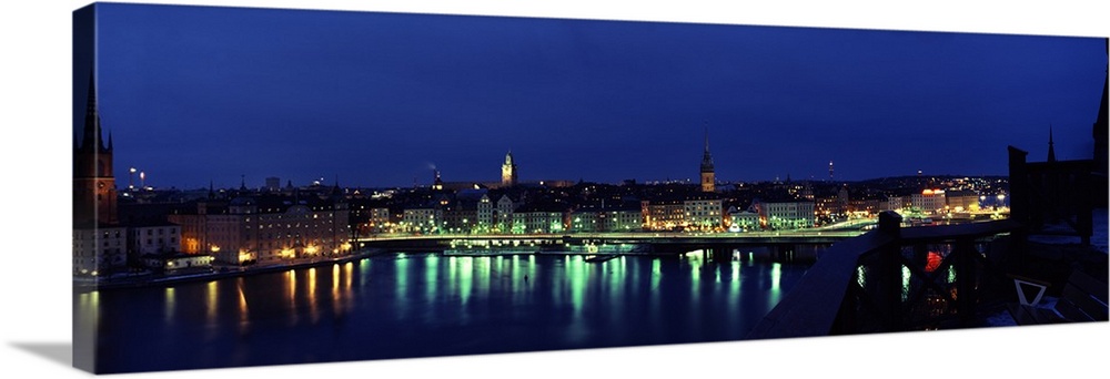Buildings in a city lit up at night, Gamla Stan, Stockholm, Sweden Wall ...