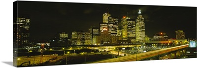 Buildings in a city lit up at night, Gardiner Expressway, Toronto, Ontario, Canada