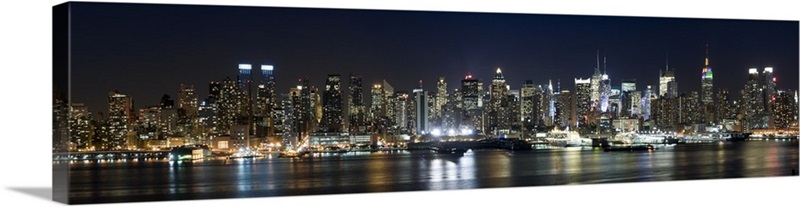 Buildings in a city lit up at night, Hudson River, Manhattan, New York ...