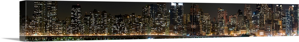 Buildings in a city lit up at night, Hudson River, Upper West Side, Manhattan, New York City, New York State,