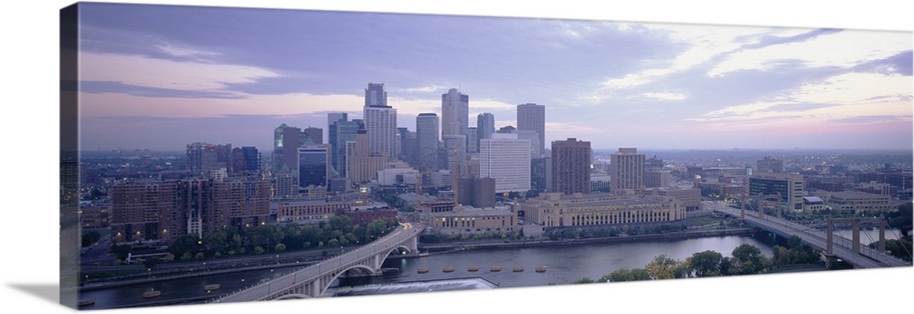 Large panoramic picture of downtown Minneapolis sitting on the banks of the Mississippi River.
